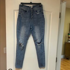 Distressed Blue Denim Jeans